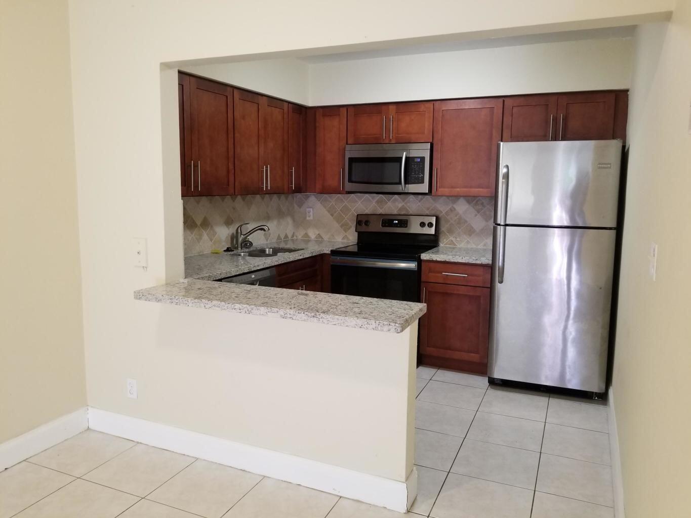 Updated Freshly Painted 2 Bedroom / 1 Bathroom with Beautiful Remodeled Kitchen with Granite Counter tops & SS appliances. Tile in living room and laminate in bedroom with Updated Bathroom. Front parking. Rent includes water, trash, sewer and laundry room access on premises. *Ready to move-in conditions* Fast Approval* Close to I-95, Shopping Centers and 15 mins to Relaxing Beaches.
