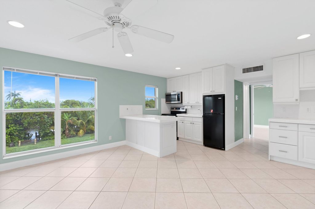 Photo of 731 Hummingbird Way #9, North Palm Beach, FL 33408 (MLS # R11046356)