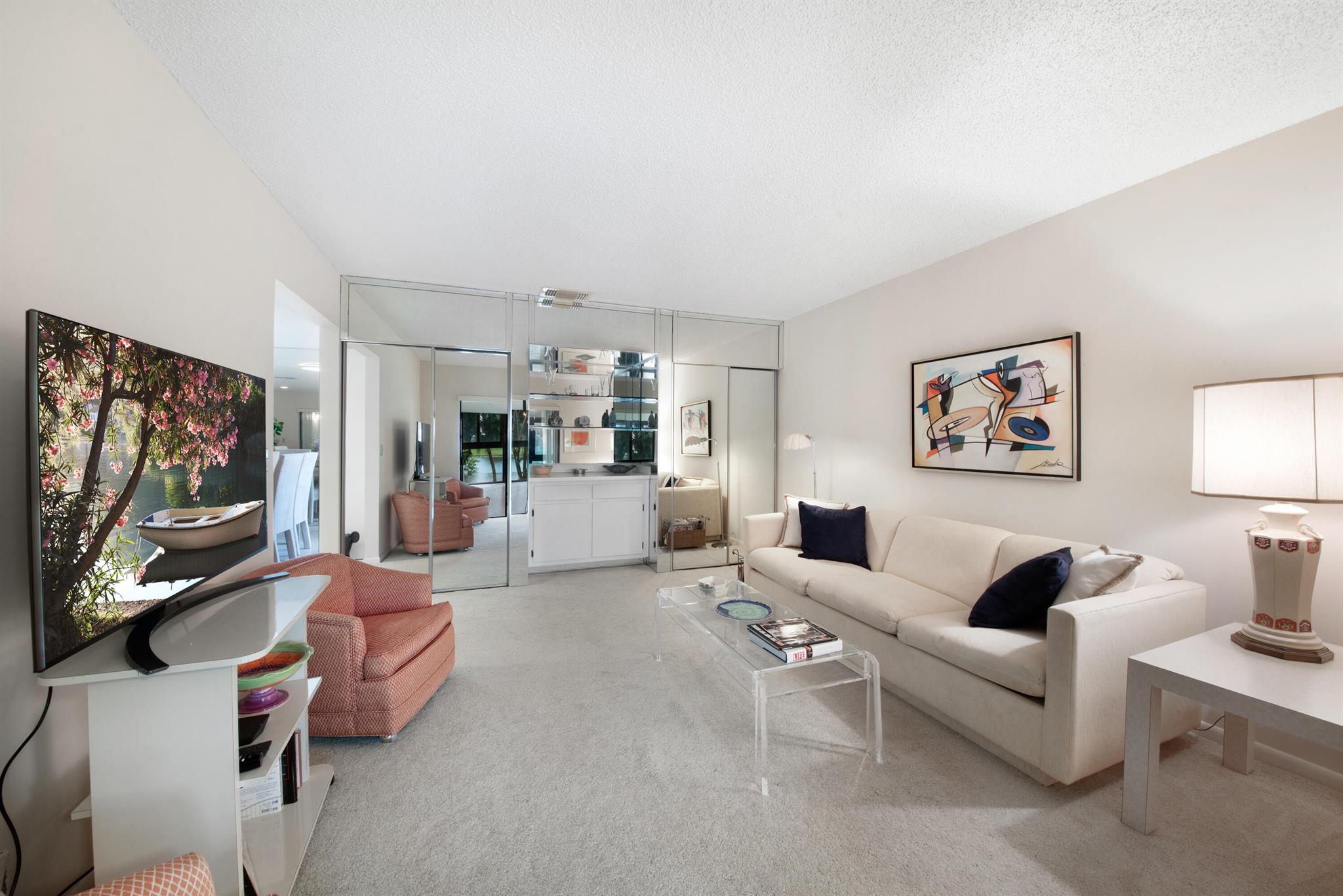 Welcome to The Palms! Come see this immaculate and bright 2nd floor unit with extra large rooms and plenty of storage space. The third bedroom can be used as an office/den. There are water views from almost every room, including the large impact glass enclosed balcony. Take advantage of the conveniently located community pool that is within walking distance as is the Boca Lago Country Club with optional seasonal and annual memberships available. There is a BRAND NEW ROOF and the fact that the seller will pay the balance of the assessment is a great bonus for the new owner. Enjoy recently replaced stainless steel appliances and air conditioner. This unit has been lightly used by only one family.... When you come to see this unit, you will not want to leave