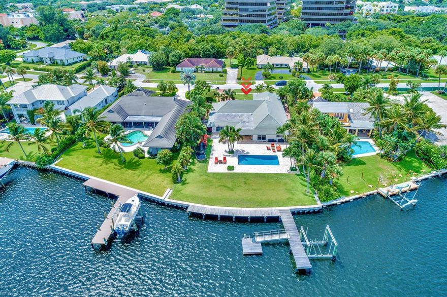 Enjoy the TRUE ESSENCE of South Florida living in this brilliantly designed CBS residence in the highly desirable neighborhood of Hidden Key!  Immediately upon entering this warm and spectacular residence you will experience wide water views that will take your breath away. Enjoy watching the kids laugh as they wake board or water ski on one of South Florida's most memorable waterways. This community is known for epic trick or treat & NO HOA! This premier lot (.5 acre!) centered in the middle of Little Lake Worth and is situated with exceptional views of Lost Tree Village. This impressive property is located in close proximity to both the Palm Beach Inlet & as well as shopping, first class restaurants and phenomenal schools.