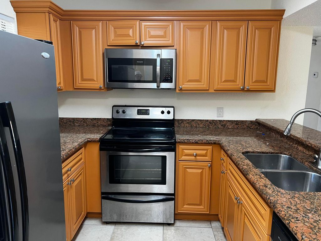 Photo of 1541 Balfour Point Drive #F, West Palm Beach, FL 33411 (MLS # B26017835)