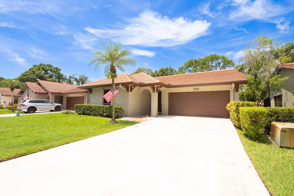 We're baa-a-ck! And better than ever with brand new remodeled bathrooms! Sitting on the 5th hole of the Golf Course, is this gorgeous 2/2/2 in Starling Court in West Villages, Martin Downs! Step through the entrance and you'll see the beautiful Wood-Look Tile Flooring throughout the living areas and kitchen. An entire wall of windows/sliders along the living room and dining room provide a light, bright spacious ambiance. Dark Granite kitchen countertops and bar offer a level of sophistication matched by the glass-tiled backsplash.