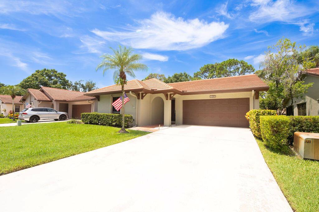 We're baa-a-ck! And better than ever with brand new remodeled bathrooms! Sitting on the 5th hole of the Golf Course, is this gorgeous 2/2/2 in Starling Court in West Villages, Martin Downs! Step through the entrance and you'll see the beautiful Wood-Look Tile Flooring throughout the living areas and kitchen. An entire wall of windows/sliders along the living room and dining room provide a light, bright spacious ambiance. Dark Granite kitchen countertops and bar offer a level of sophistication matched by the glass-tiled backsplash.