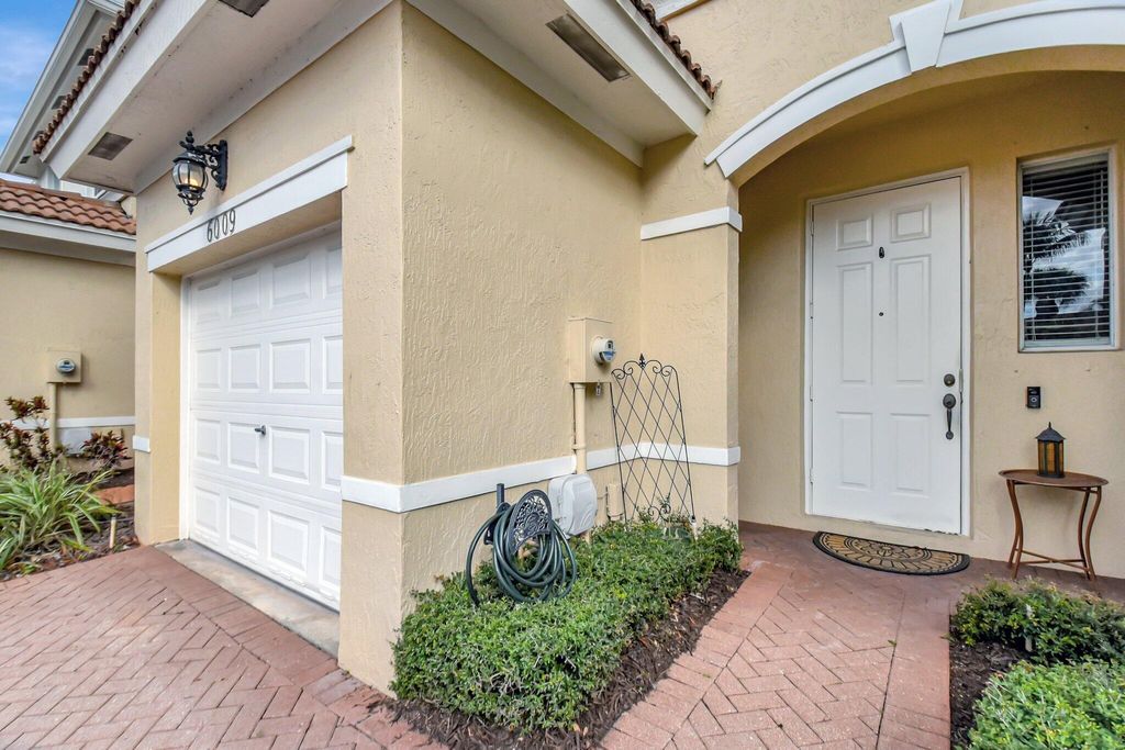 Photo of 6009 Seminole Gardens Circle, Riviera Beach, FL 33418 (MLS # R11063554)