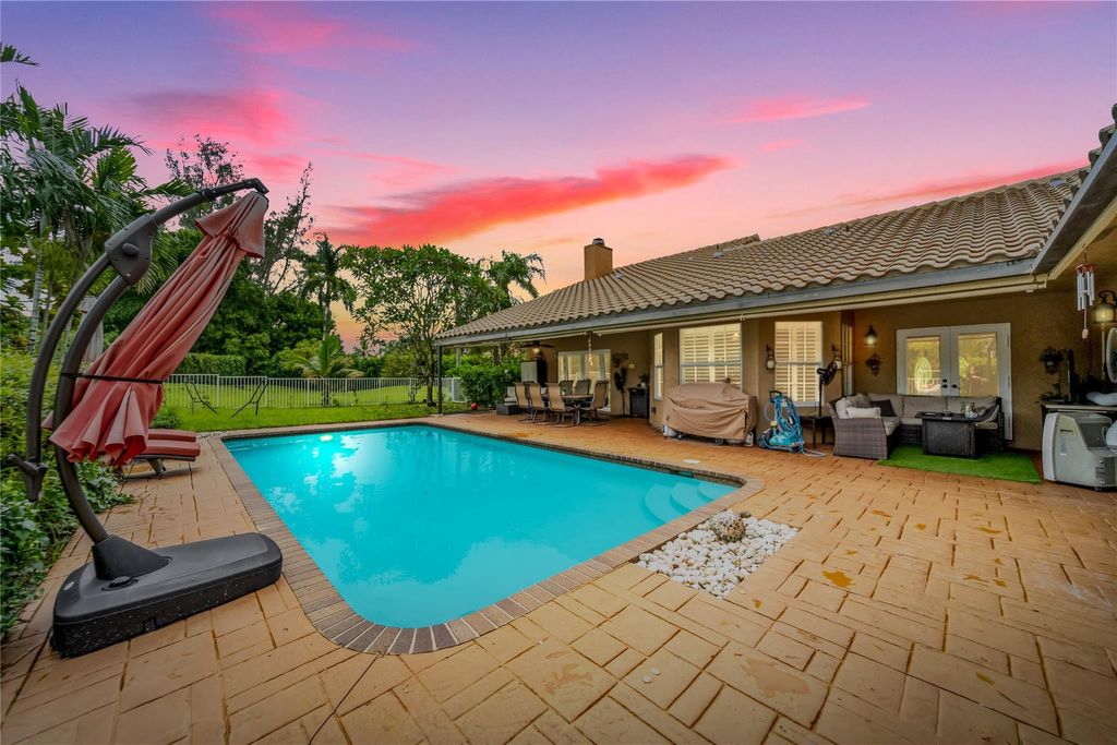 Photo of 7604 Lexington Ln, Parkland, FL 33067 (MLS # F10527579)