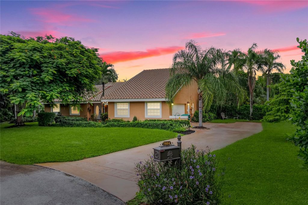 Photo of 7604 Lexington Ln, Parkland, FL 33067 (MLS # F10527579)