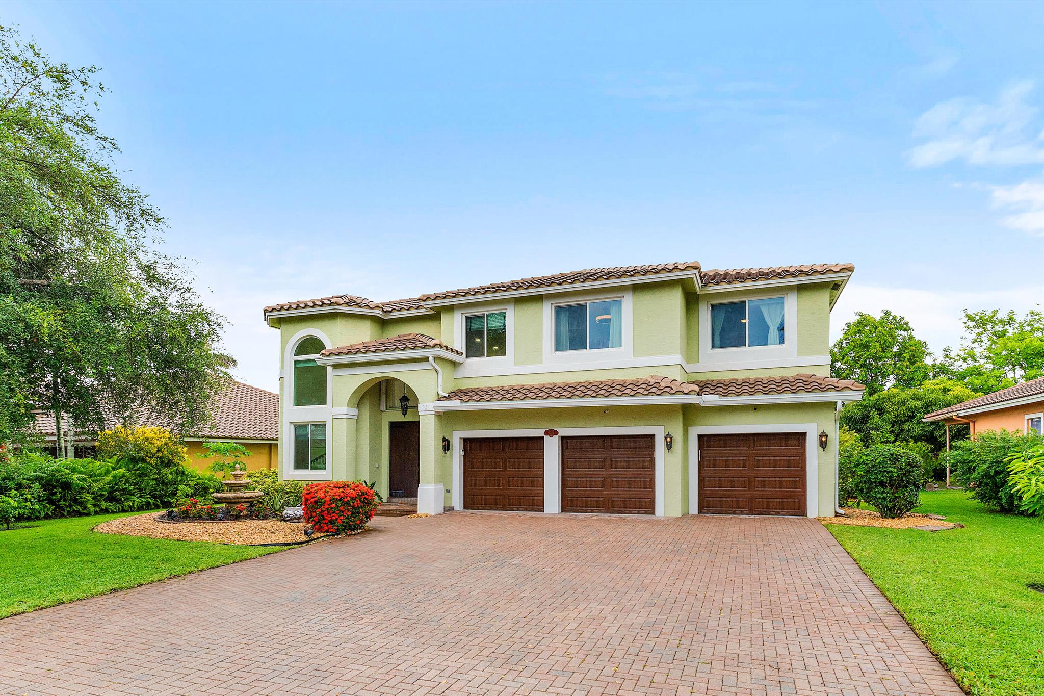 Sophisticated and move in ready 4BR/3BA waterfront home with a brand new roof, pool, and oversized three car garage. Light-filled interiors showcase soaring ceilings, hurricane impact windows and doors, and high end designer finishes throughout. The chefs kitchen stuns with top-tier appliances, a showpiece quartz island, and open concept flow, perfect for entertaining. The expansive primary suite is a luxurious escape, featuring an oversize layout with a private study or lounge retreat. A full bedroom and bath on the main floor provide flexible space for guests or work from home needs. Enjoy tranquil views, low HOA and no approval process - modern luxury with effortless comfort.