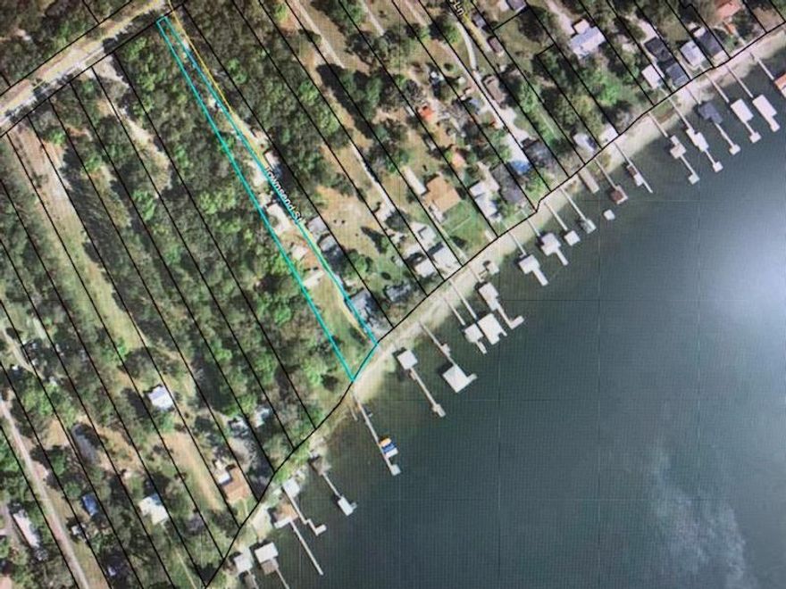 ONE OF A KIND PROPERTIES!!! NOW BEING OFFERED !!! THE BEAUTIFUL AND MOST DESIRABLE '' KINGSLEY LAKE''.  A TOTAL OF THREE HOMES AND 11 RENTAL LOTS WHICH HAS PROVIDED YEARS OF PROVEN RENTAL INCOME !!! TWO DOCKS AND A BOAT HOUSE WITH OVER 165 FT OF LAKE FRONTAGE WITH YOUR OWN PRIVATE BOAT RAMP ON THESE TWO BEAUTIFUL LAKEFRONT LOTS !!! WHITE SANDY BEACH FRONTAGE AND CRYSTAL CLEAR LAKE WATER !!!  LOT 32 IS PARCEL #021564-000-00,  AND LOT 33 IS PARCEL # 021565-000-00. THIS IS A MUST SEE PROPERTY!!!