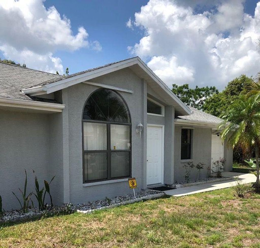 Photo of 838 SW Trouville Avenue, Port Saint Lucie, FL 34953 (MLS # R10712908)
