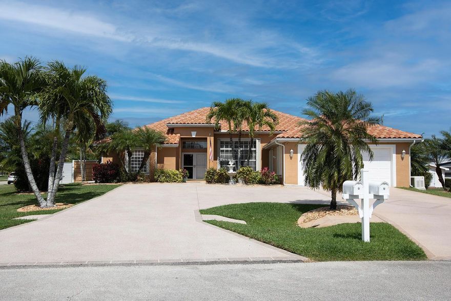 Meet elegance & sophistication with this, one of a kind 4/2/2 custom pool home on oversized corner lot with brand new barrel tile roof, centrally located off Port St Lucie Bkvd. Stunning & exquisite upgraded executive home with modern flair, large tile throughout and all the bells and whistles, completely fenced in with upgraded custom fencing, oversized circular driveway to accommodate all your toys, including boat or RV, large backyard and covered porch overlooking the exotic oasis & oversized heated saltwater pool and spa, with full house generator, shed & complete accordion shutters. The majestic interior features a dramatic double door entryway opening to the open concept living space with large great room, formal dining, open gourmet kitchen with open bar & upgraded cabinetry,