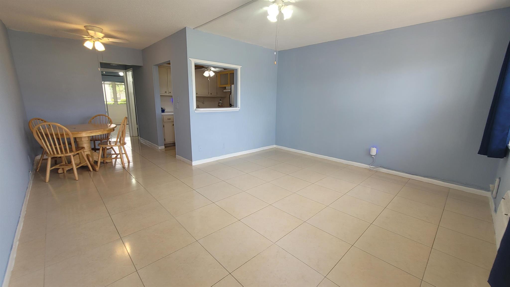 Bright and charming, lightly updated, one bedroom, one bath condo on the ground floor. Freshly painted, consistent 18-inch ceramic tile throughout with 5 ceiling fans. Bathroom updated with a walk-in shower with grab bars. Newer appliances in kitchen. Screened and enclosed Lanai with a ceiling fan and a security door leading out to grassy and landscaped rear yard. Lanai is not facing parking lot. Front and rear air conditioners replaced in 2024 and water heater replaced in 2025. Roof replaced in 2024 and building and sidewalks have been painted. Building is in very good condition with no upcoming maintenance and NO SPECIAL ASSESSMENTS! Very low HOA fees. Building also features a welcoming and inviting community patio with seating and a gas grill. Convenient to laundry room and mailbox.