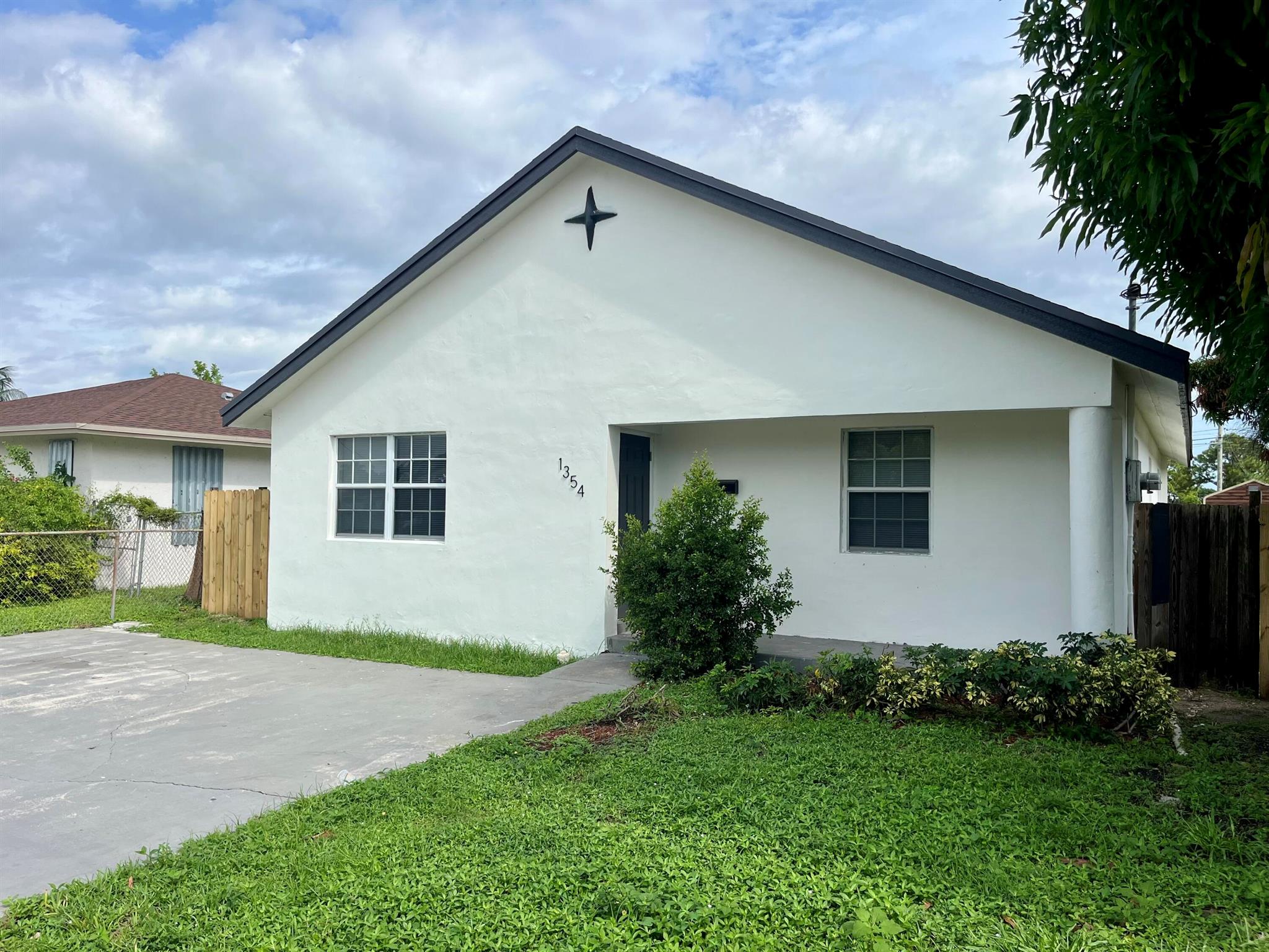 Don't miss out on this beautiful single family home in the heart of Riviera Beach. Spacious 4 bed, 2 bath home with 2 car driveway. Brand new roof is currently being installed. New HVAC system and water heater, updated kitchen with granite counters, freshly painted inside and out, new light fixtures and flooring. Both bathrooms have also been updated and the yard is fully fenced with a gate.