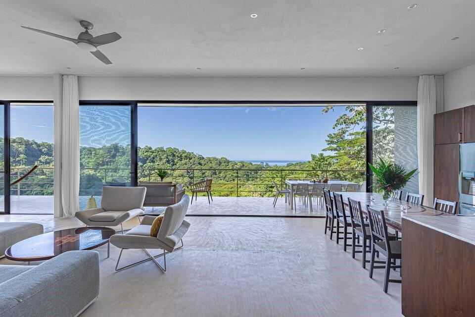 You'll be High Enough in this luxury modern art estate with sensory overloads of Costa Rica's lush jungle & vibrant wildlife, stunning ocean view sunsets and the soothing sounds of rivers & ocean waves in the tranquil Playa Hermosa 7 River Neighborhood.
Entertainment minutes away in World-Class destination Santa Teresa, a hip/international melting pot filled with resorts, wellness, superb dining & vibrant nightlife.
Turnkey gated home sits on 3100SM with 4 separate units:
1 bed/1.5 bath penthouse w/ office & laundry room.
3 separate 1 bed/1 bath units. Large pool deck, lounge area, laundry, parking, 2 storage rooms, and casita for employees on property. Versatile income producing retreat or permanent home that has room for expansion. 1.2 mi to beach. Escape to Pura Vida!