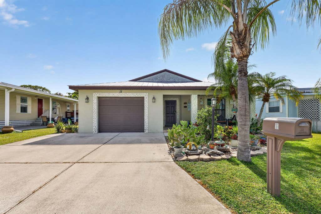 Photo of 11 SE Flamenco Way, Port Saint Lucie, FL 34952 (MLS # B26050165)