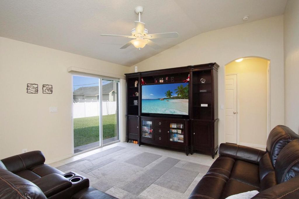 Photo of 3111 SW Hickenlooper Street, Port Saint Lucie, FL 34953 (MLS # R10942647)