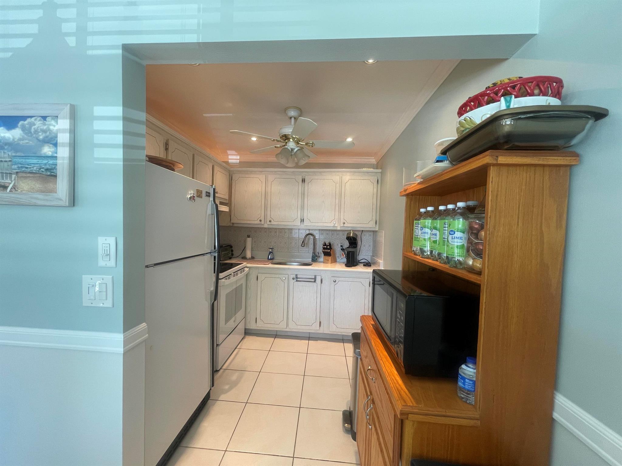 Updated & Move-In Ready! Location, Location, Location! This beautifully updated and furnished 2-bedroom, 1.5-bath second-floor condo is nestled in a desirable 55+ community offering resort-style amenities. Enjoy a sparkling pool, relaxing sauna, fitness center, bocce ball, billiards room, library, and more -- all just steps from your door. Conveniently located minutes from PBI Airport, top restaurants, houses of worship, shopping malls, parks, and South Florida's stunning beaches.Laundry facilities are included in the HOA -- no more quarters or reload cards needed!This upgraded home combines comfort, convenience, and community -- perfect for seasonal or year-round living!