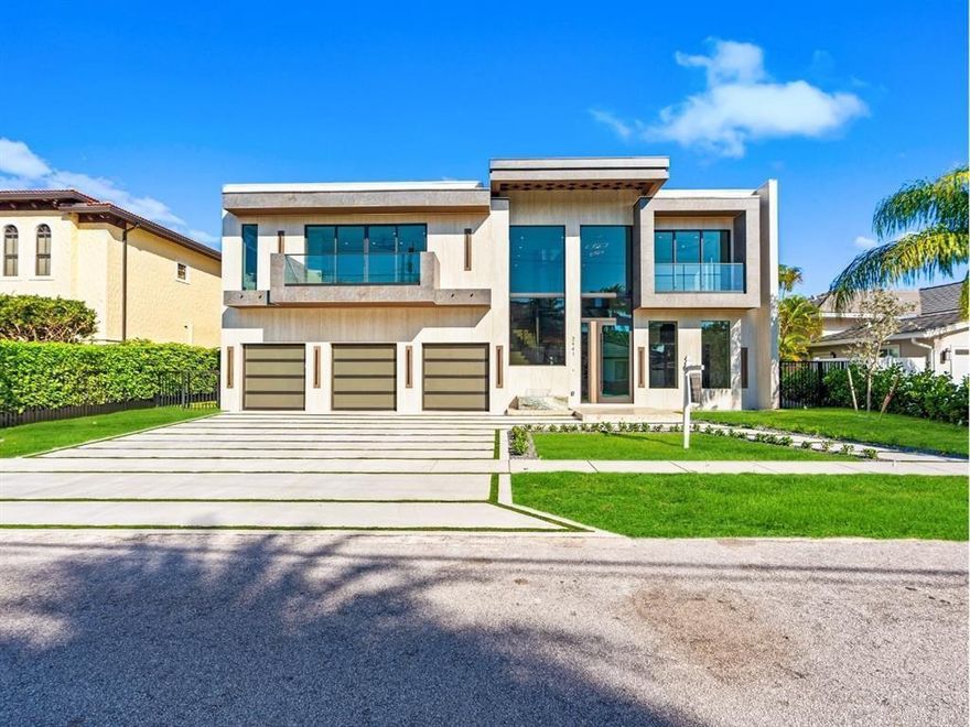 This newly constructed waterfront modern home by Soverns Developers combines luxury with a prime location and a newly constructed 80' seawall. Designed by the award-winning Barretta and Associates, the residence boasts architectural excellence with 5 bedrooms, 5 full bathrooms, 1 cabana bath & 1 powder room. The main suite offers a private balcony, while the VIP suite ensures ultimate comfort. A tastefully appointed home office and a chef-inspired kitchen with Wolf and Sub-Zero appliances elevate the interior. A 3-stop glass elevator connects each floor, leading to a rooftop terrace with breathtaking views. Outside, enjoy a custom pool, spa, and a covered terrace with a built-in summer kitchen, ideal for outdoor entertaining. A 3-car garage adds convenience to this home of pure elegance.