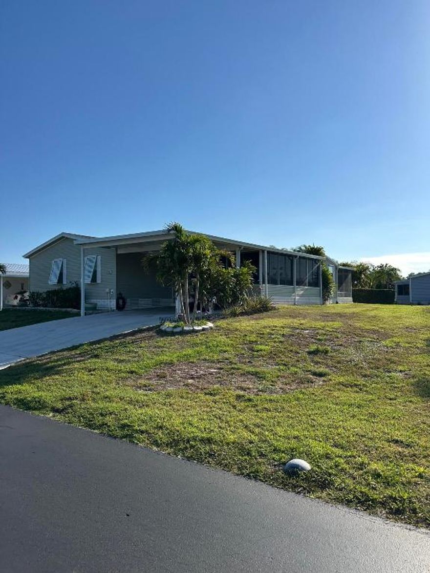 Welcome to this spacious and beautifully maintained 3-bedroom, 2-bath triple wide manufactured home, located in the vibrant 55+ community of Tropical Isles in Fort Pierce, Florida. Built in 2003, this home offers over 2,000 square feet of comfortable living space with a thoughtful layout and a warm, inviting atmosphere.
Step inside to find a custom kitchen perfect for the home chef, complete with ample cabinetry, generous counter space, and modern appliances. The home features a formal living room, dining area, and a cozy family room, offering plenty of space for both entertaining and everyday living. One of the true highlights is the sun-drenched Florida room, ideal for enjoying morning coffee or relaxing with a good book while soaking in the tranquil surroundings.