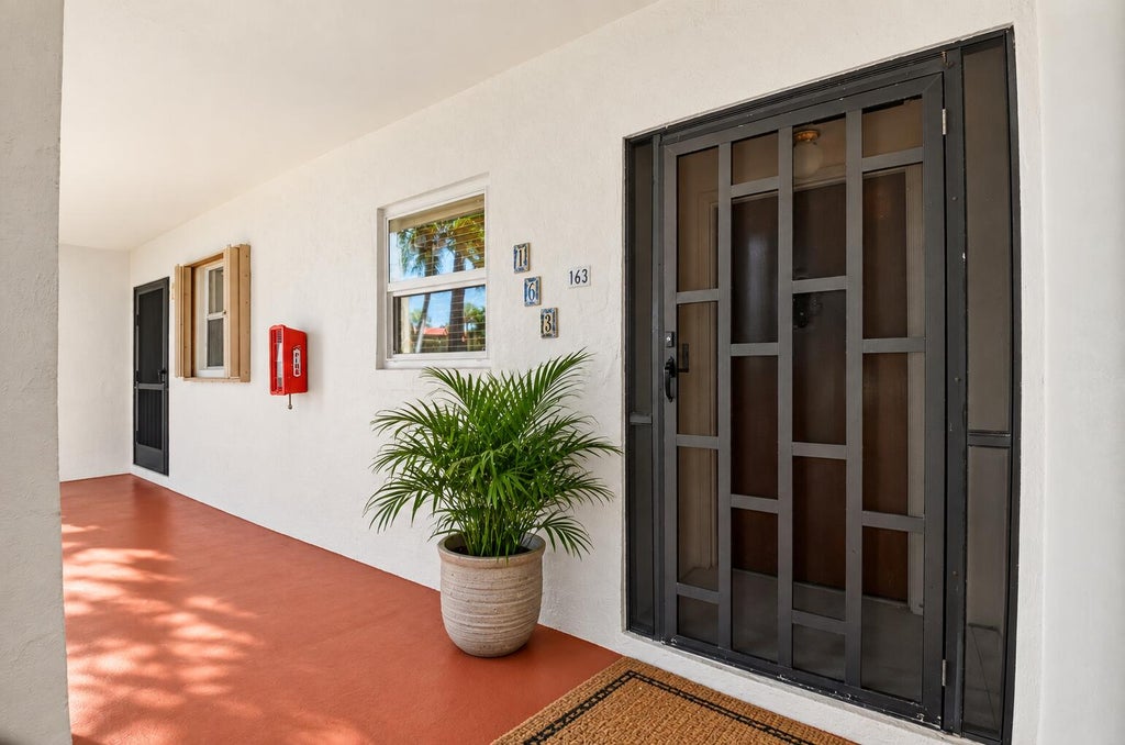 Photo of 163 LAKE EVELYN Drive, West Palm Beach, FL 33411 (MLS # B26082633)