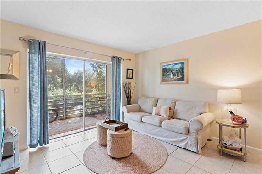 This charming 2/2 condo is located in Parkview Gardens at Royal Palm Beach. Enjoy tranquil water views from your screened balcony or a nice walk around Veteran's Park, which is across the street from the building. This park's amenities include amphitheaters, the Seeds Café, picnic pavilions, splash pad, playground, waterfall. All ages welcome! The primary bedroom features a door to the balcony and walk in closet. AC 2014. Hot water heater 2017. Roof 2014. Stacked washer & dryer. All appliances with a service contract. Stainless kitchen appliances and pass through to dining area. Hurricane shutters. Second bedroom with new windows. Special Assessment $1,000 for reserves. Great location close to shopping, dining and much more!