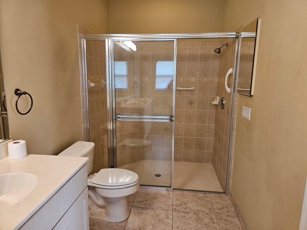 Photo of 394 NW BREEZY POINT Loop, Port Saint Lucie, FL 34986 (MLS # B26069663)