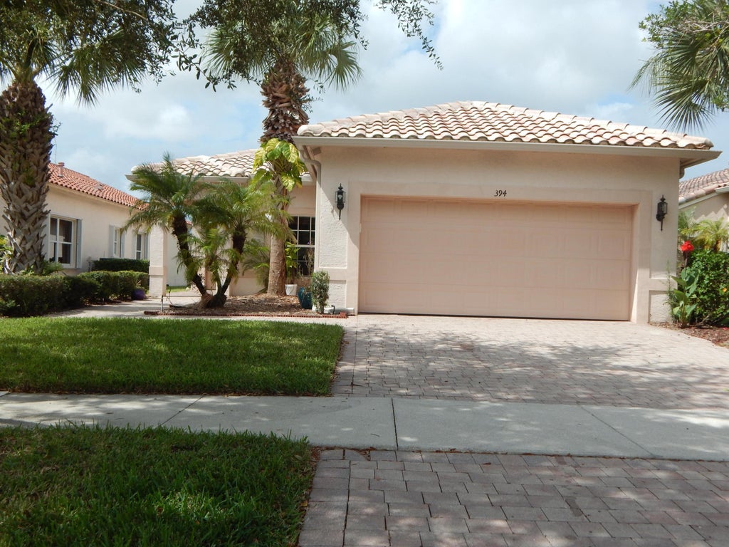 Photo of 394 NW BREEZY POINT Loop, Port Saint Lucie, FL 34986 (MLS # B26069663)