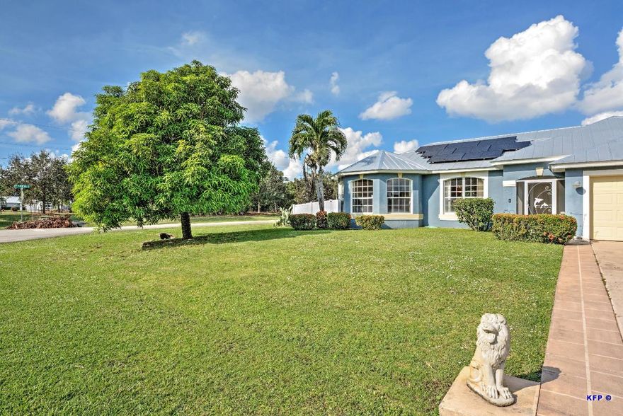 Top of the line 2021 Solar Panels ($60,000 value) on 2021 metal roof. (Solar Panels will be paid by seller at closing). Electric ranges between $25 & $50 a month. Featuring state-of-the-art amenities, elegant design, and impeccable finishes, this heated pool is a centerpiece that promises an unrivaled relaxation and entertainment experience. 2024 A/C & water heater. (Big Mango tree in front yard). Corner lot with Canal across the street. Canal is great for fishing. A Short drive away from the Beach/Ocean, Gyms (including a 24 hour gym), Multiple grocery stores (including BJ's Wholesale & Sam's Club, Aldi's, Publix), Walmart Supercenter, and Multiple Restaurants. Clover Park, New York Mets