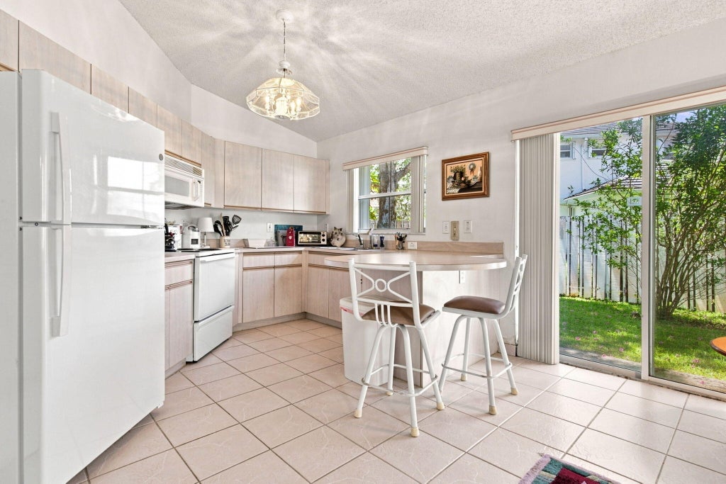 Photo of 7460 NW 1st Manor, Plantation, FL 33317 (MLS # B26064061)