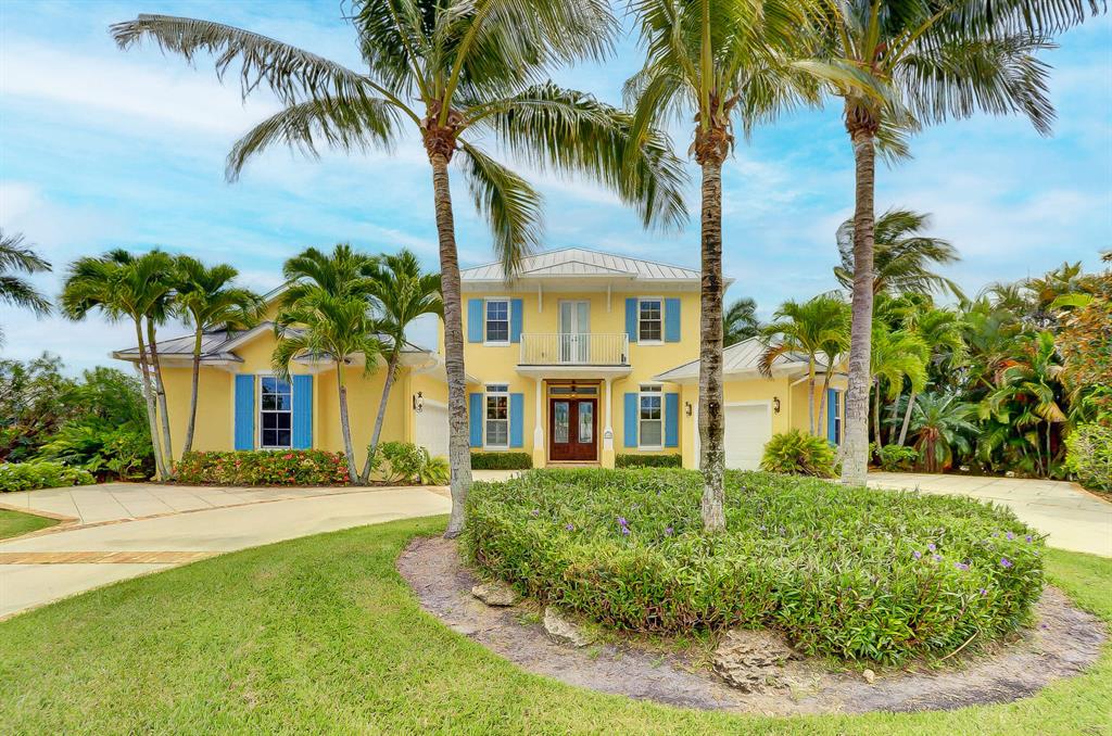 Waterfront Custom home build with 4 bedrooms and 5 bathrooms. Heated pool and spa, private dock with boat lift. Downstairs Master bedroom and 2 bedrooms and 2 baths upstairs with family room and balcony with spiral staircase to access pool area. Entertaining home with wet bar and wine cooler, 20kw generator, downstairs laundry room and plenty of storage throughout the home. Large kitchen and dining area that makes for excellent entertaining and family gatherings. Lovely circular driveway that says ''Welcome to our Florida Home''. All impact glass throughout home. Call us today for a private showing!