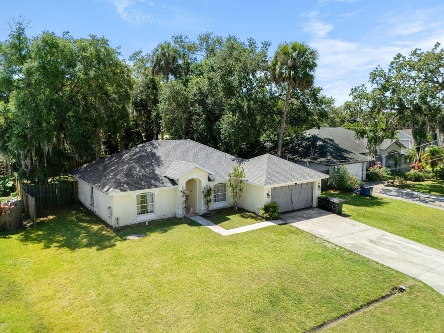 Comfort and practicality in this beautiful 4-bedroom CBS home in a prime Port St. Lucie location!  Enjoy peace of mind with a NEW roof, 2022 A/C, and NEW water heater. The spacious split floor plan features high vaulted ceilings, new laminate flooring, and a pragmatic layout that's perfect for everyday living. Open concept floor plan where the kitchen opens to a large living area. Step outside to a fully fenced backyard with an 8-foot gate, providing access for boats or toys. No HOA or deed restrictions. Schedule a showing today to see this home in person!