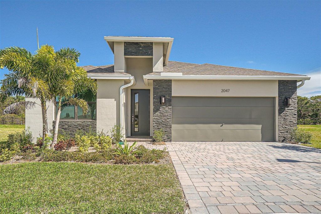 Photo of 2047 NE Ocean Dunes Drive, Jensen Beach, FL 34957 (MLS # R10975375)