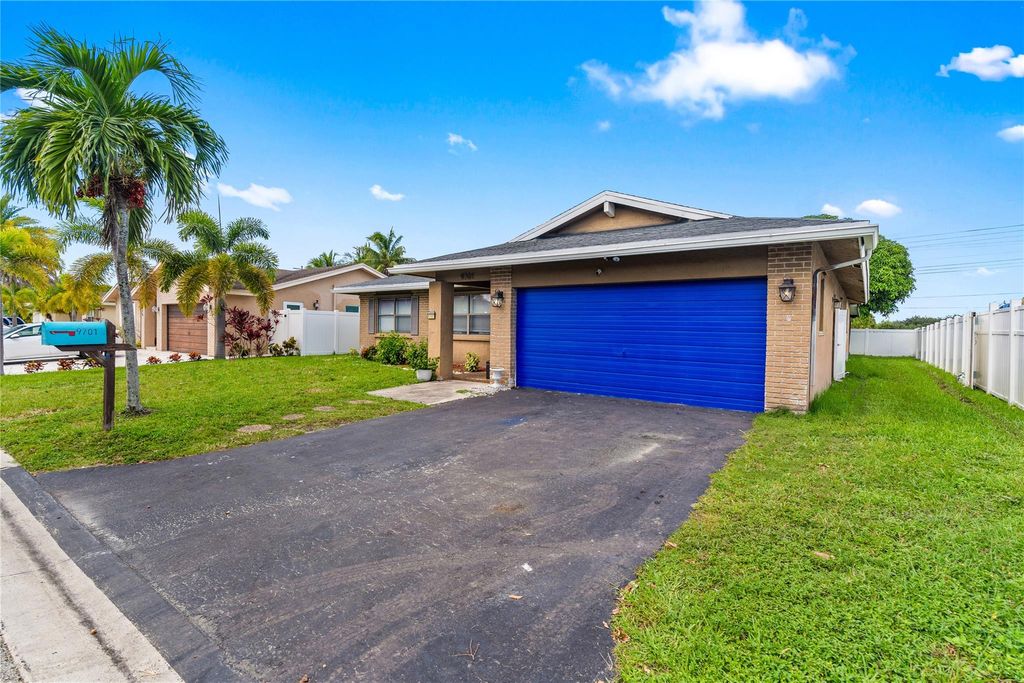 Photo of 9701 NW 83rd St, Tamarac, FL 33321 (MLS # F10531996)