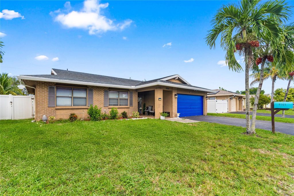 Photo of 9701 NW 83rd St, Tamarac, FL 33321 (MLS # F10531996)