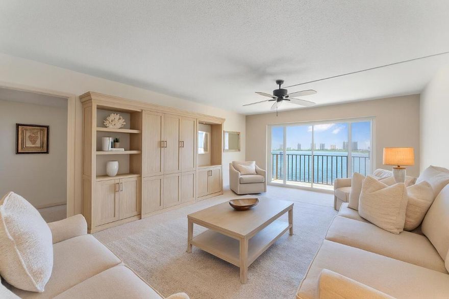 NO ASSESSMENTS. MILESTONE INSPECTION PASSED.This 2-bed, 2-bath condo delivers direct water views in a gated community. The oversized primary suite includes a generous walk-in closet, and the spacious balcony is perfect after a day at Kelsey Park, located right next door. You're steps from the newly energized Lake Park district: Lake Park Marina, SeaHawk Prime, Paradise Tavern, North Palm Country Club, and the best of the PGA corridor. Community perks include a pool, putting green, and BBQ deck. A clean canvas ready for your dream waterfront retreat. Washer/dryer in unit. Some photos virtually staged.