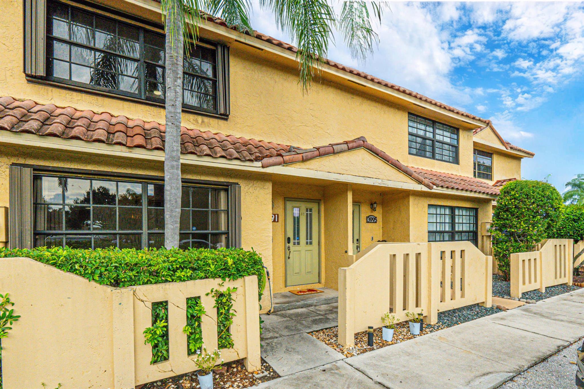 Low HOA on this well-maintained, 3 Bedroom, 2.5 Bath Waterfront Townhome with Luxury upgrades. Quartz kitchen, Large Master Bedroom with Resort-style bath and closet. Relax or Entertain on your extended, outdoor patio with Amazing lake views. Quiet and secluded location within walking distance to the community pool and spa. Low HOA and move-in ready. Includes 2 assigned parking spaces outside your door and lots of guest parking. Everything you need for your South Florida living!
