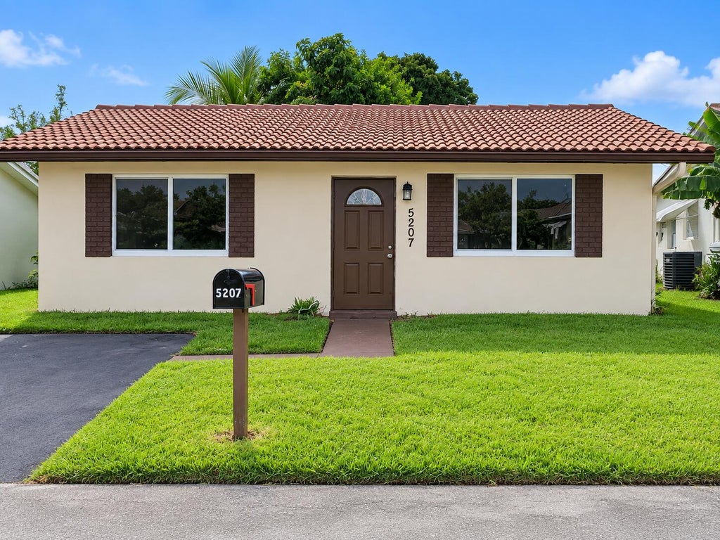 Photo of 5207 NW 28TH Avenue, Tamarac, FL 33309 (MLS # B26077545)