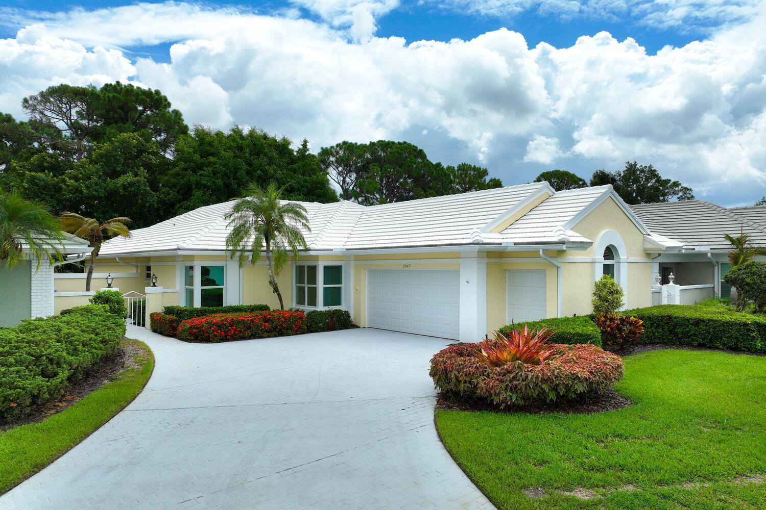 This home in Monarch Country Club is located on the 15th fairway of the Arnold Palmer Championship Golf Course, offering beautiful views from the living room. It features three bedrooms, two bathrooms, and a two-car garage with space for a golf cart. Recently remodeled, upgrades include a newer roof with leaf guard gutters, impact-resistant windows, and light oak luxury vinyl tile. The primary bathroom has modern Euro-style cabinets, and the kitchen includes new LG appliances and a wine fridge. An enclosed porch provides additional relaxation space. The monthly HOA fee of $541 covers gate maintenance, lawn care, cable, high-speed internet, and biannual roof cleaning, while the exterior, walkways, and driveways are pressure cleaned and repainted every six years.