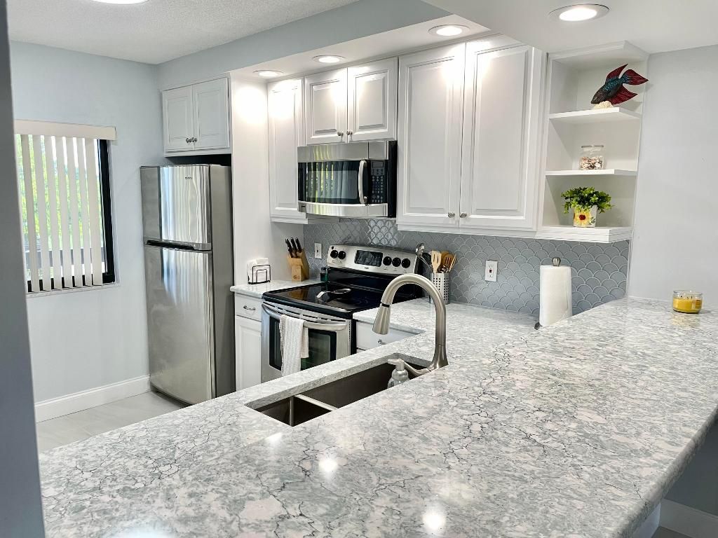 Photo of 901 SW Seafarer Circle #202, Jupiter, FL 33477 (MLS # R11096962)