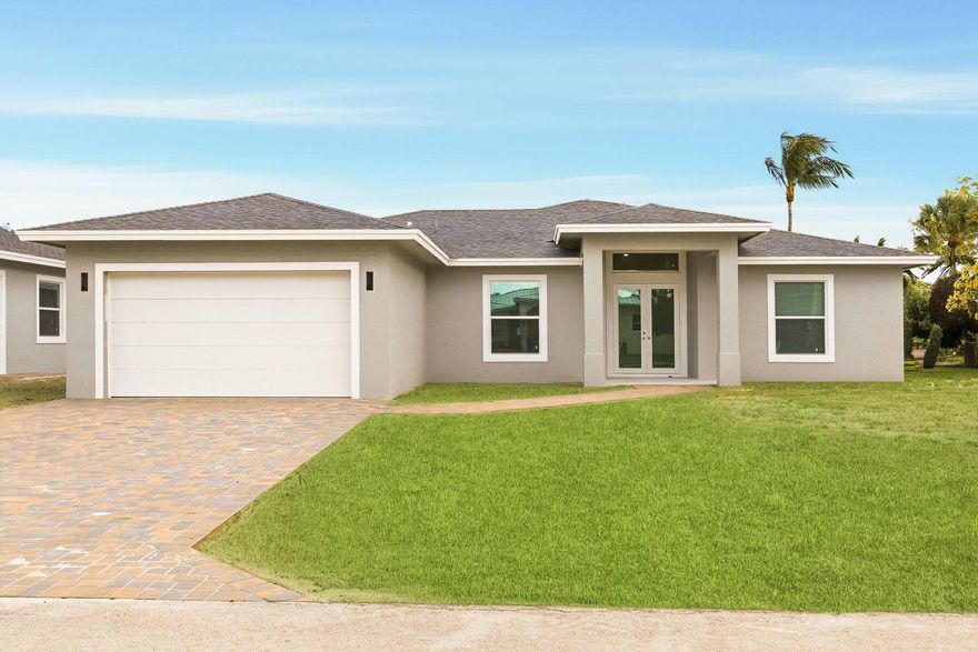 **Waterfront New Construction**--Best Value in Palm Beach County! This brand-new 4BR/3BA CBS home offers 2,200+ sq ft on an oversized .26-acre lot in a hidden-gem community. Features include 10' ceilings, Italian plank tile, a chef's kitchen with quartz waterfall island, 42'' cabinets, and full impact windows/doors. The primary suite boasts a custom 5-piece bath and dual walk-in closets. Enjoy a huge fenced yard, covered patio, irrigation system, and DOCKS ALLOWED with navigable canal access to Lake Osborne & Ida South no bridges--ideal for boating, fishing, and watersports. NO HOA, minutes to the beach and I-95. Preferred lender offers rates in the 5%'s + closing cost credits for approved buyers!