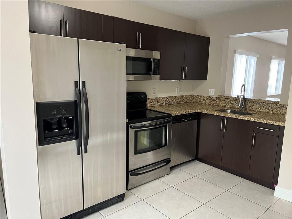 Photo of 6255 SW 47th Manor #104, Davie, FL 33314 (MLS # F10508569)