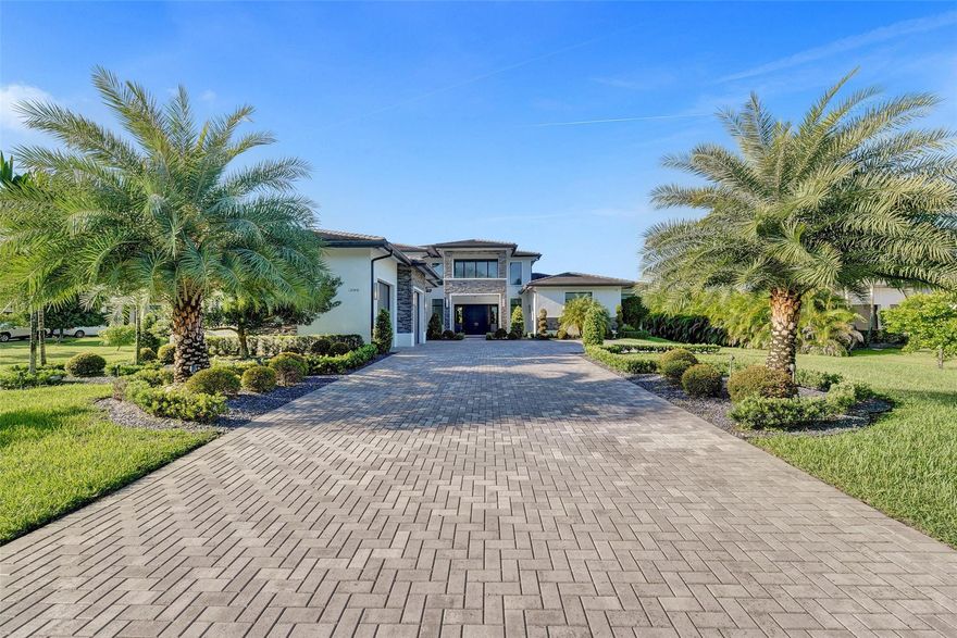 Experience luxury living in this expansive 5BR/5BA home with over 7,200 sq ft on a quiet cul-de-sac. Soaring volume ceilings and large windows fill the interiors with natural light, creating a bright and welcoming atmosphere. The oversized chef’s kitchen features a generous island and flows seamlessly to a spacious covered patio with a summer kitchen, ideal for hosting family gatherings or entertaining friends year-round. Relax in the private primary suite, complete with spa-like bath, dual vanities, and ample closet space. Private basketball court, oversized 3-car garage, and multiple versatile living areas perfect for work, play, or relaxation. This home offers the perfect combination of space, comfort, and style, conveniently located near shopping, dining, parks, and top-rated schools.