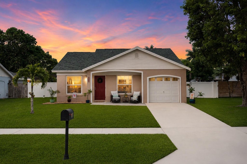 Photo of 1450 Denlow Lane, Royal Palm Beach, FL 33411 (MLS # B26044758)
