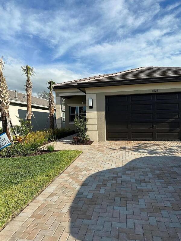 Discover resort-style living in this exquisite 3-bedroom, 2.5-bathroom Tribeca model home, located in the vibrant Valencia Grove at Riverland, an exclusive 55+ community in Port St. Lucie, FL. Perfectly positioned right on the scenic Paseo and bike path, this home offers unmatched access to the social lifestyle that defines this premier community. Amenities: 34,000 sq. ft. Social Club: Resort-style pool, card rooms, billiards, and event spaces. 16-acre Sports & Racquet Club: 51,000 sq. ft. of wellness facilities, including tennis, pickleball, bocce, and an indoor pool. On-site cafe/bar, plus a vibrant calendar of clubs, classes, and events like aqua fitness, yoga, Zumba, and group trips. Near Port St. Lucie's beaches, PGA Village golf, and NY Mets Spring Training.