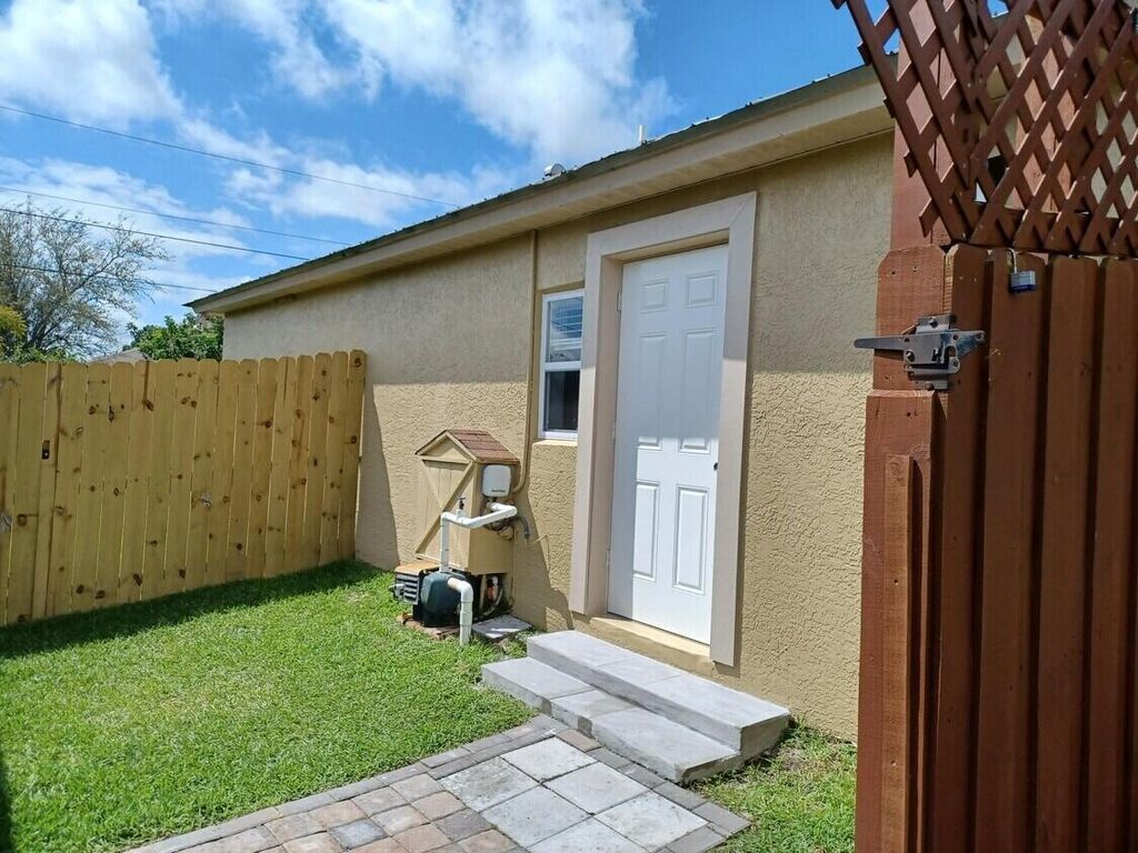 Photo of 1622 SW Crawford Avenue, Port Saint Lucie, FL 34953 (MLS # R11081994)