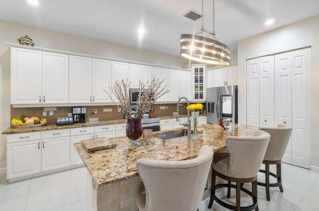 Photo of 9271 Madewood Court, West Palm Beach, FL 33411 (MLS # B26019557)