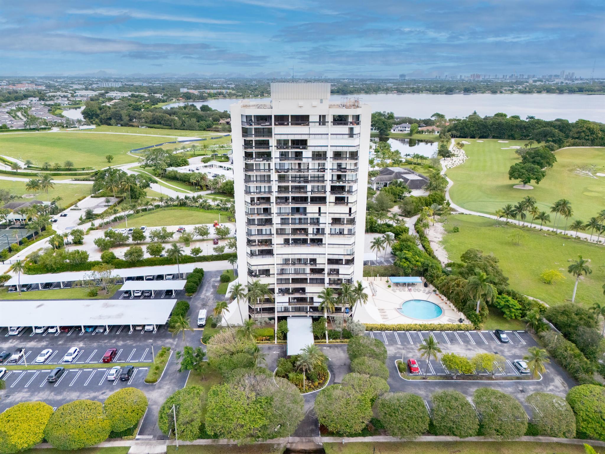 Beautifully updated open 3 bedroom 2 bath corner unit with floor to ceiling Hurricane Impact Sliders throughout plus hurricane shutters to enjoy the amazing panoramic views of the Dutchman's Pipe Golf course. Views are magnificent day & night plus this condo has 2 balconies for plenty of outdoor living. Open Kitchen, beautiful ceramic tiles throughout, granite counter tops, Stainless steel appliances & beautiful cabinets. Unit comes with 2 parking spaces 1 covered & 1 uncovered. Large walk-in closet, with newer Bosch AC & Hot Water heater. Doorman building with manager on site in prestigious gated community. HOA fee Includes Wifi, Cable, water, Fitness center, party room and beautiful pool. Great location near Palm beach outlets, Beaches, restaurants, downtown WPB, Airport & so much more!