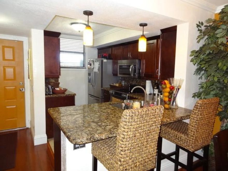 This rental home is located in the fantastic 24 hour guard gated community Lake Emerald! Two oversized bedrooms & two remodeled upscale baths. The Kitchen remodel features Stainless steel appliances, custom Cherry wood cabinets & granite counters. Cherry wood floors throughout, California closets. Spectacular lakefront sunset views. There are 3 pools, Jacuzzi, sauna and gym room. The snack bar located at the community center serves a fabulous Sunday Brunch. Washer & dryer, parking spot just steps away.