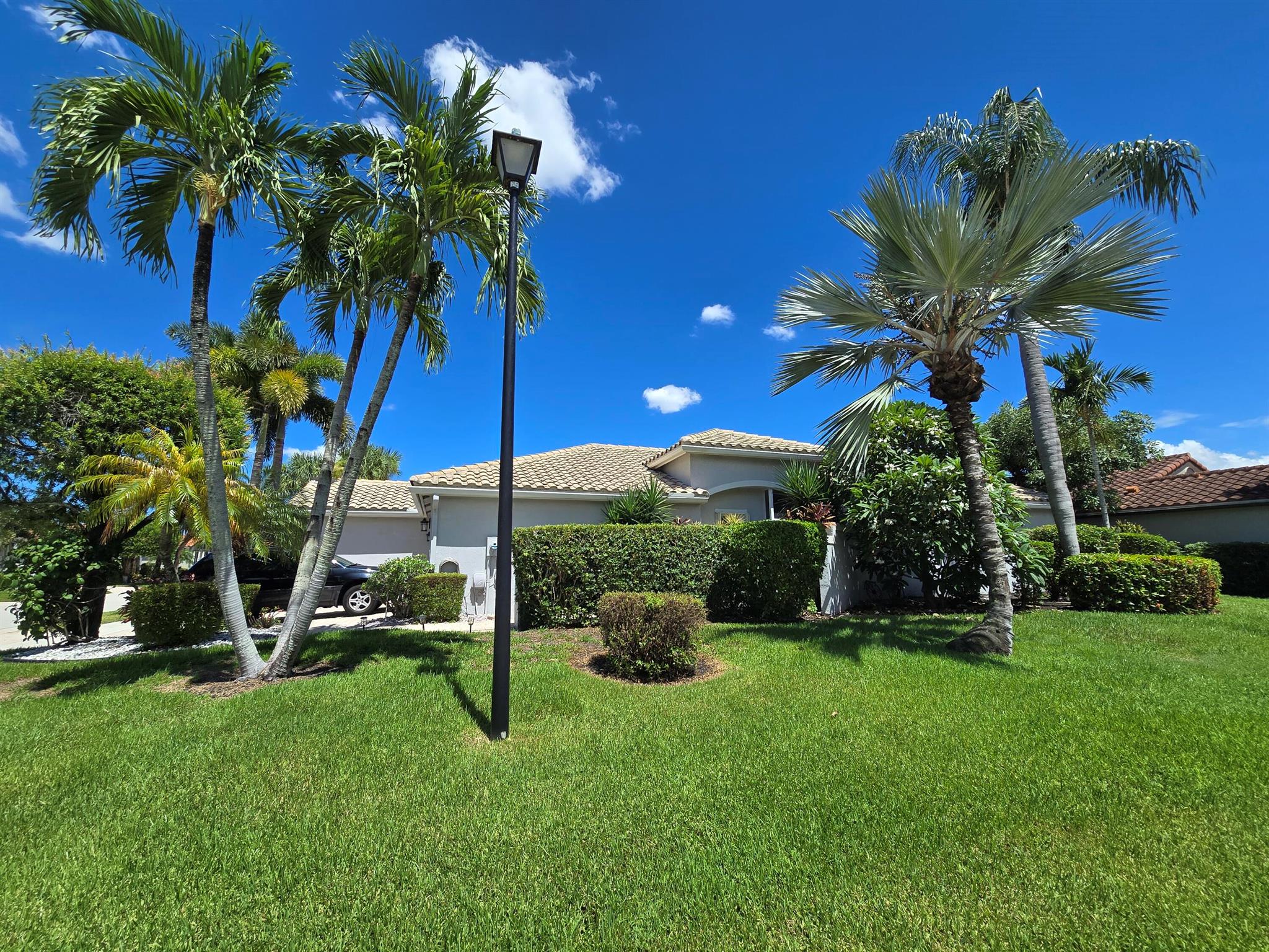 Lovely home in a very active gated community. This home is open and bright, has tile floors in the main living area.. Granite kitchen with white cabinetry, a great room that opens to a large screened and covered patio, featuring a hot tub. The Clubhouse offers a variety of amenities and a cafe. Home is situated on a corner lot close to the satellite pool. Close to shopping, restaurants, and entertainment, the Florida Turnpike