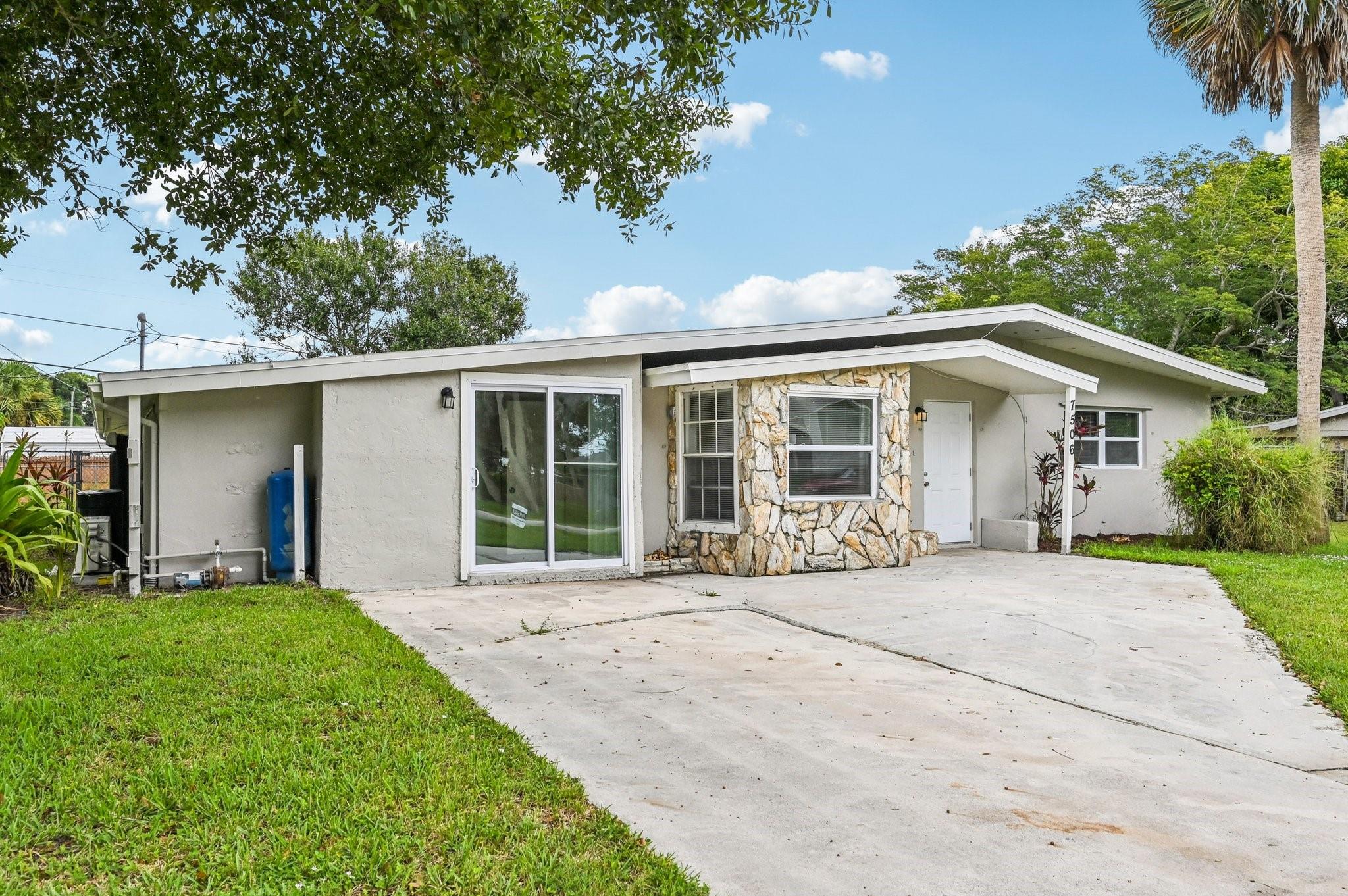 Bright and inviting 3-bedroom, 2-bath home in Fort Pierce featuring an open layout that seamlessly connects the living, dining, and kitchen areas. Large windows fill the space with natural light, while durable vinyl and tile flooring add style and easy maintenance. The kitchen offers updated appliances including a cooktop, microwave, and dishwasher, along with abundant cabinet storage. Each bedroom includes a closet, and the home also provides a dedicated laundry room. Relax or entertain in the sunroom, enjoy the covered patio, or take advantage of the spacious fenced backyard with an additional storage room. Conveniently located near shopping, local parks, and just a short drive to US-1, I-95, and the beautiful Fort Pierce Inlet beaches.
