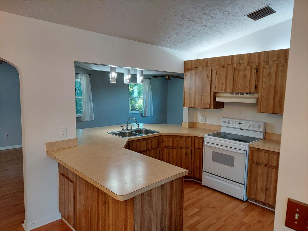 Photo of 2555 SW Monterrey Lane, Port Saint Lucie, FL 34953 (MLS # R10962507)